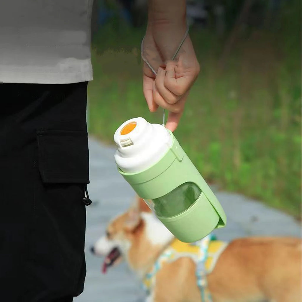 $14.99 -Portable Pet Water Bottle with Integrated Food Storage – Dual-Function Travel Feeder for Dogs and Cats